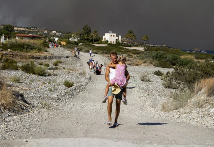 Greek authorities evacuate some 19,000 people as wildfire blazes on the Greek island of Rhodes