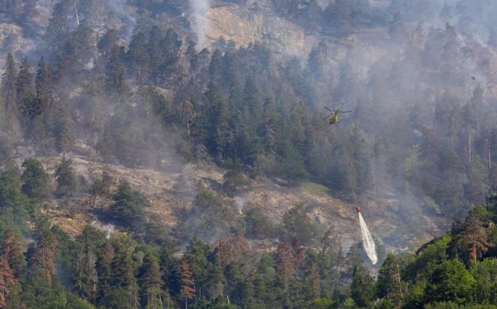 Switzerland fights to contain forest fire near Italy border as winds pick up