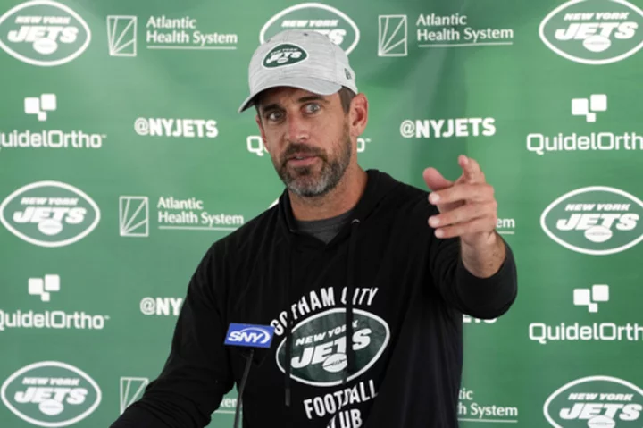 Aaron Rodgers takes a pay cut and signs a 2-year, $75 million deal with the Jets, AP source says