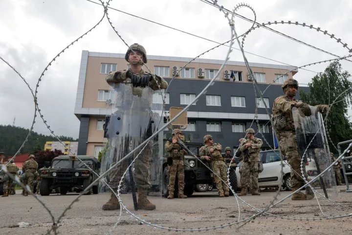 NATO soldiers deploy around Kosovo town halls in standoff with Serb protesters