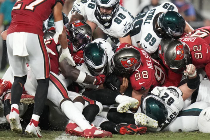 Jalen Hurts throws for TD, runs for another as Eagles thump Buccaneers 25-11 to remain unbeaten