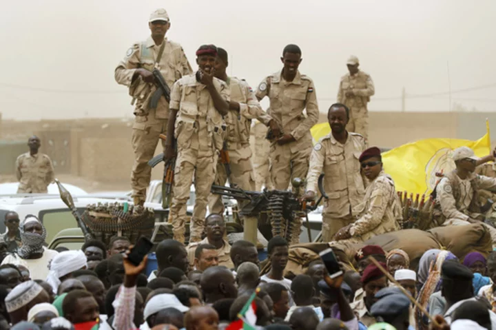 A drone attack kills at least 23 in Sudan’s capital as rival troops battle, activists say