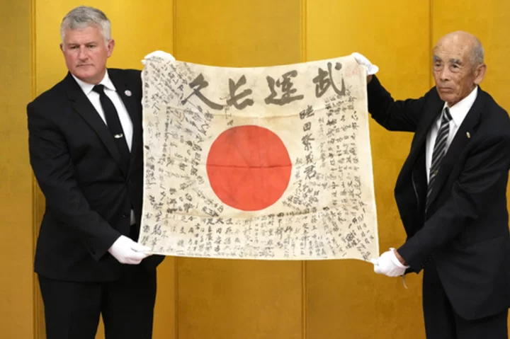 It's a miracle, say family of Japanese soldier killed in WWII, as flag he carried returns from US