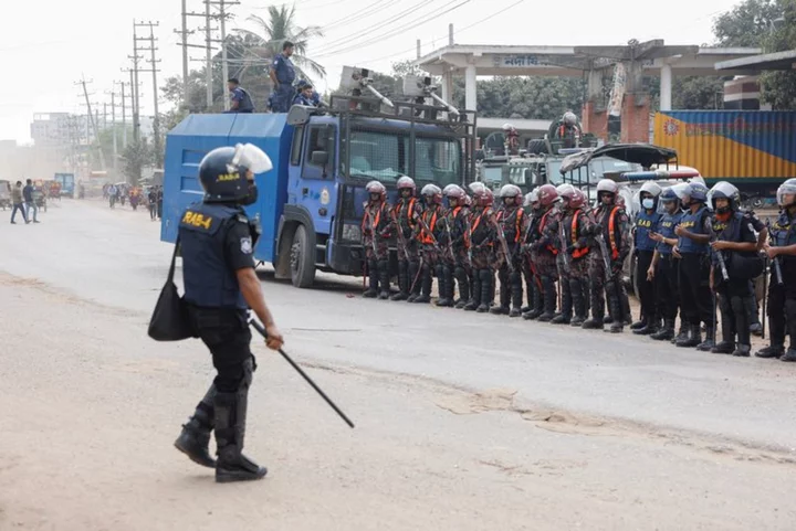 One killed as garment workers clash with police in Bangladesh over pay rise - police