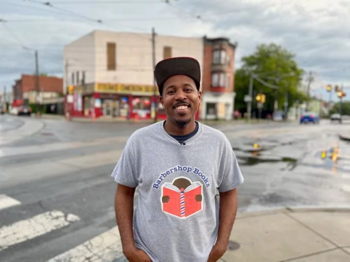 Where barbershops are a community hub, he's filling them with books to help young boys find excitement in reading