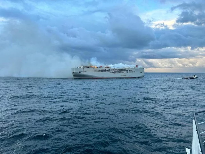 Ship carrying 3,000 cars burns off Dutch coast, crew member dead