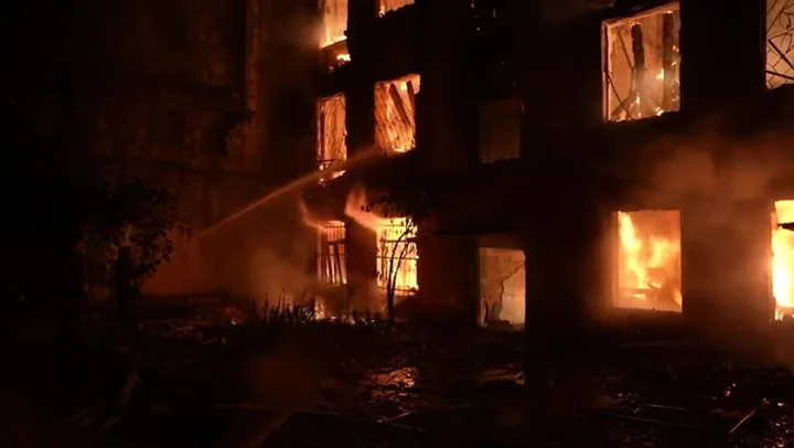 Fires rage in aftermath of Russian strike on Mykolaiv as injured woman carried away on stretcher