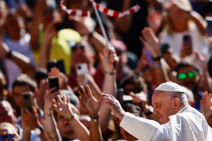 Pope out of bed and working from hospital - Vatican statement