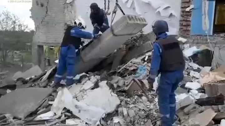 Rescuers dig through rubble after deadly strike hits Ukraine school