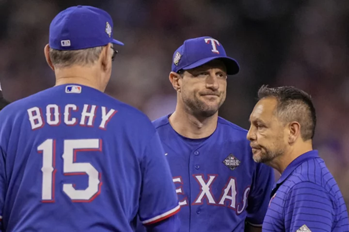 Scherzer forced from World Series Game 3 by back tightness and Jon Gray emerges from bullpen for win