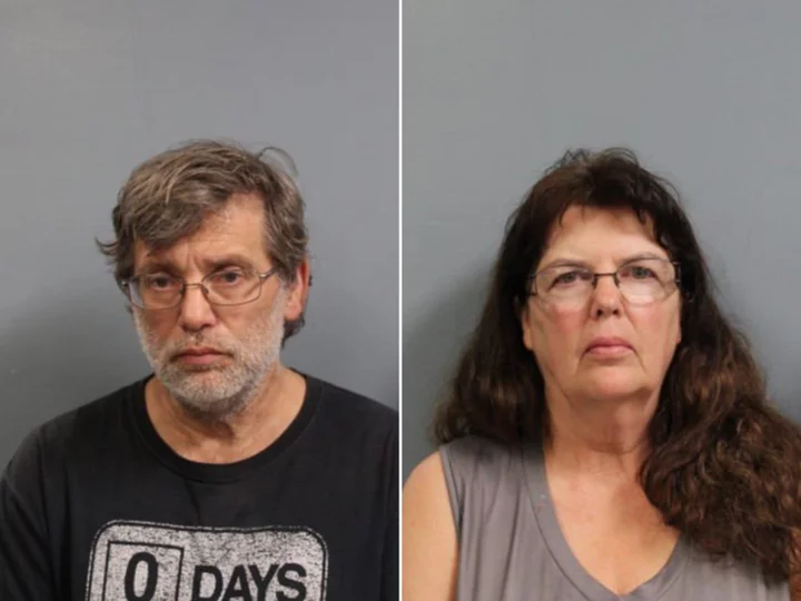 The adoptive parents of 2 children found locked inside a barn in West Virginia are facing felony child neglect charges, authorities say