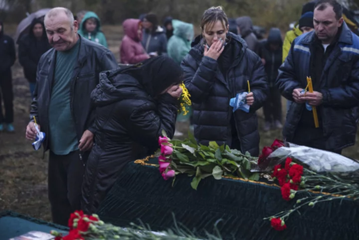 Days after deadly missile strike on Ukrainian cafe, grief and a search for answers