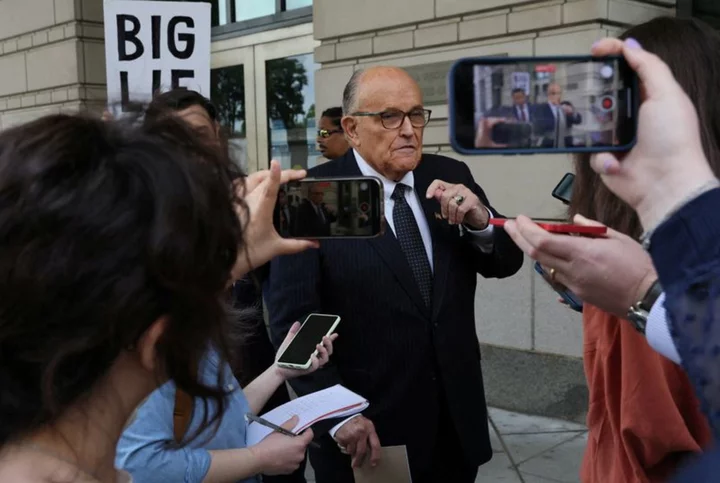 Giuliani surrenders in Trump election subversion case, $150,000 bond set