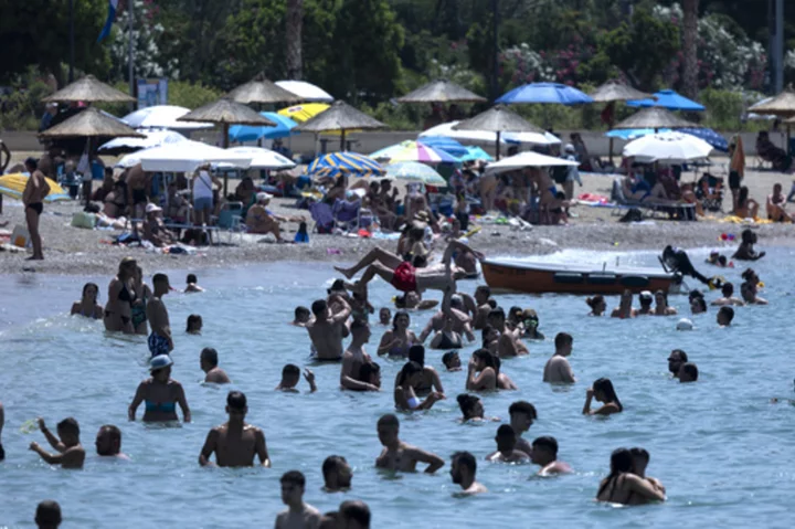 People and pets seek shade and cool as Europe sizzles under heat wave that's only going to get worse