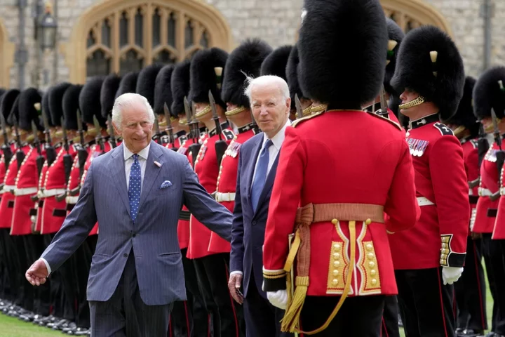Awkward moment as King Charles moves Biden on during chat with guardsman at Windsor Castle