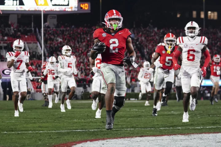 Bowers returns, No. 1 Georgia routs No. 10 Ole Miss 52-17 to punctuate another SEC East title