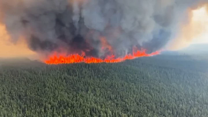 Wildfires spread in British Columbia, Quebec sees signs of progress