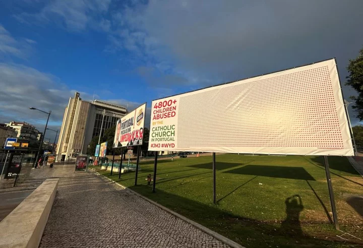 Billboard highlighting clerical abuse removed as pope arrives in Lisbon