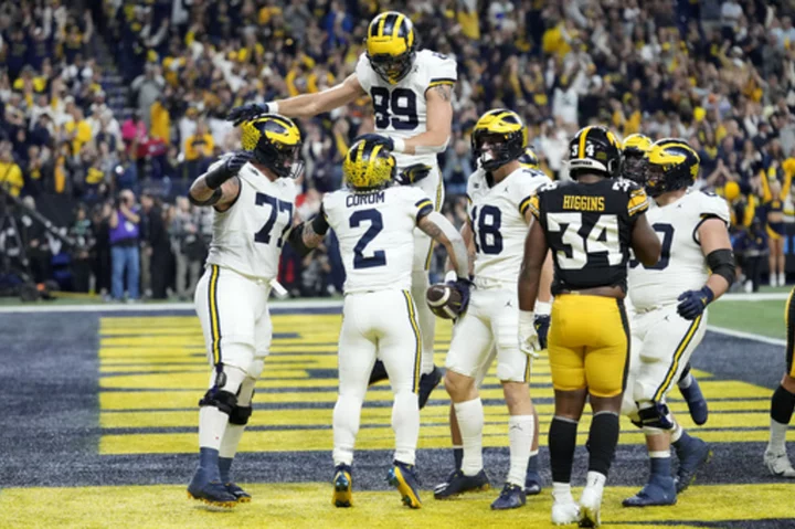 No. 2 Michigan beats No. 18 Iowa 26-0 for Big Ten title, likely to claim top playoff seed