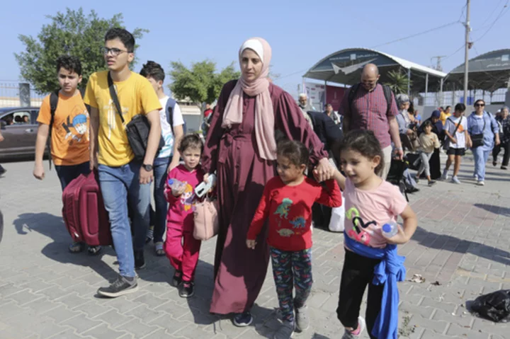 Confusion, frustration and hope at Gaza's border with Egypt as first foreign passport-holders depart