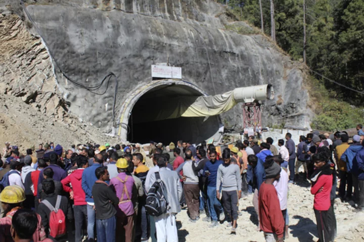 Indian rescuers prepare to drill to reach 40 workers trapped in a collapsed tunnel since the weekend