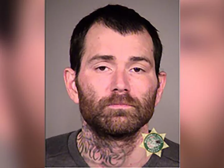 Oregon suspect, who escaped while fully shackled, taken into custody after found stuck in muddy pit