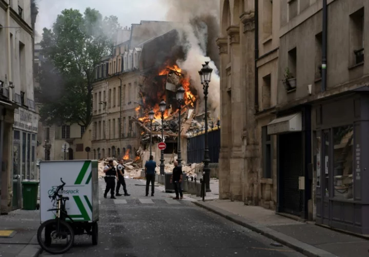 Rescuers comb through rubble of Paris building blast