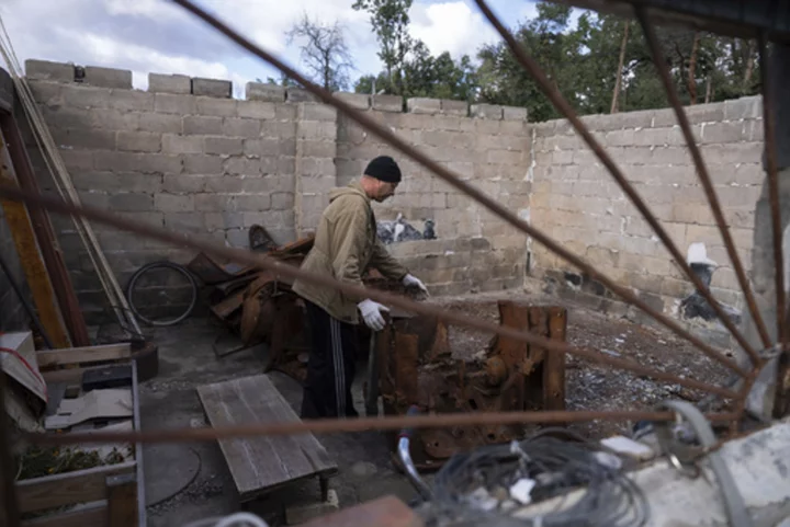 Ukrainians prepare firewood and candles to brace for a winter of Russian strikes on the energy grid