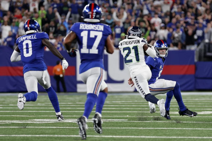 Rookie Devon Witherspoon scores on 97-yard pick six as Seahawks D leads Seattle over Giants