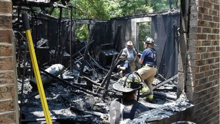 Man charged after six found dead in US house fire