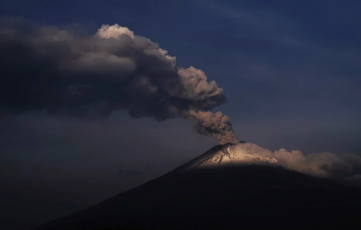 Volcano rumbles near Mexico City, coating towns with ash, disrupting flights