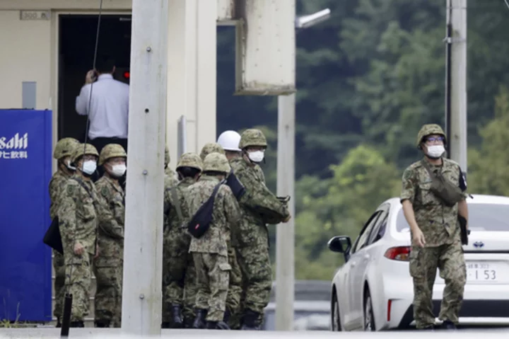 18-year-old trainee shot 3 soldiers at firing range on Japanese army base, killing 2, officials say