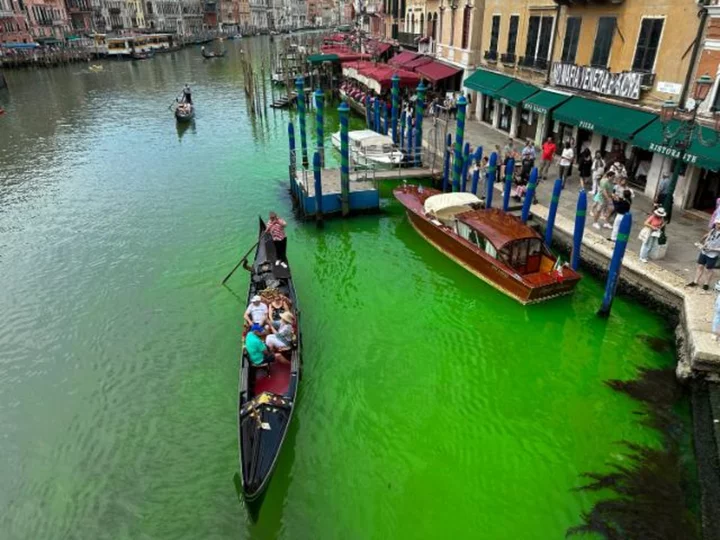 Venice authorities discover why canal turned fluorescent green