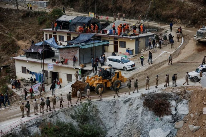 Indian rescuers say very close to reaching 41 men trapped in tunnel