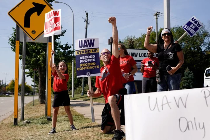 Biden, Trump to woo union workers in Michigan as auto strikes grow