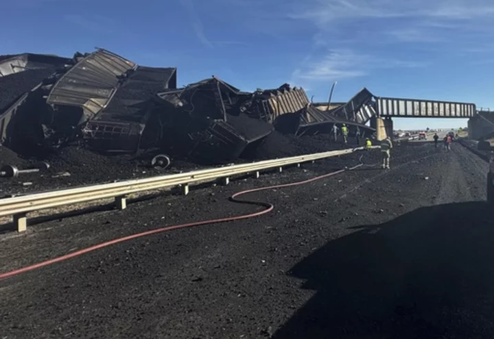 Semi-truck driver killed when Colorado train derails, spilling train cars and coal onto a highway