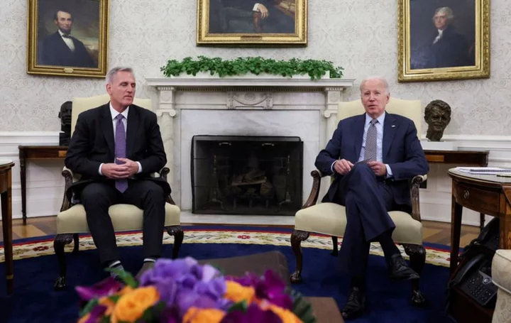 Analysis-Can Biden's handshake to a gunfight strategy fix what ails the US?