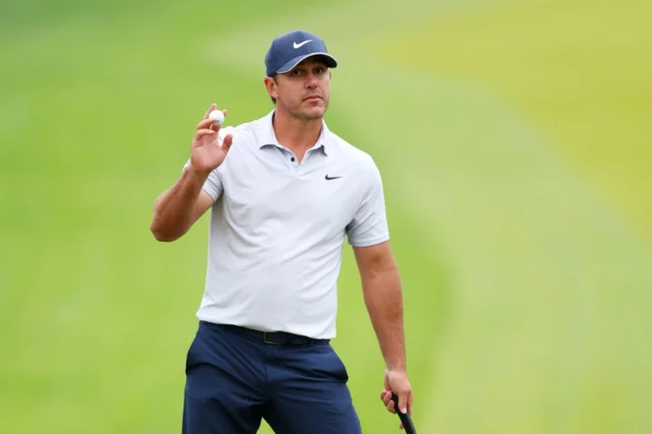 Koepka turns boos to roars in grabbing PGA lead at rainy Oak Hill