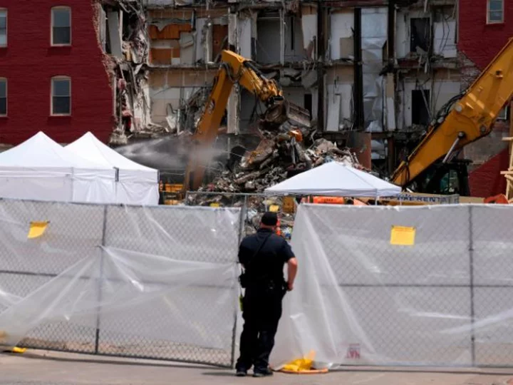 A survivor of Iowa's deadly apartment building collapse sues, saying the owner and city didn't evacuate residents despite 'imminent danger'