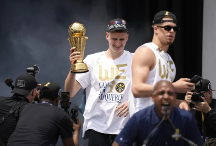 Nuggets celebrate their 1st NBA title with parade through the streets of downtown Denver