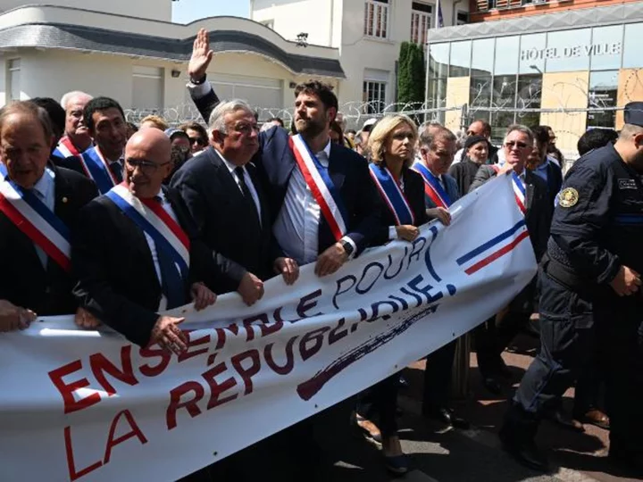 Hundreds march with French mayor whose house was attacked by burning car