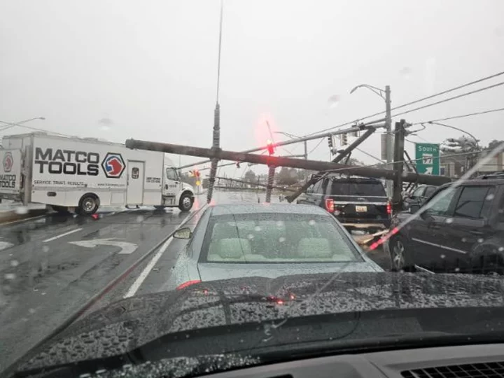 Battered Eastern US sees widespread outages after deadly storms that damaged neighborhoods and trapped drivers