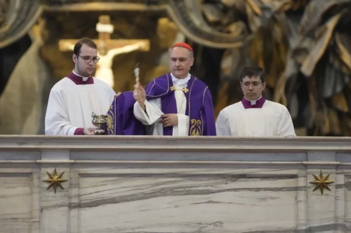 Vatican cardinal performs rite at desecrated altar in St. Peter's Basilica after naked protest