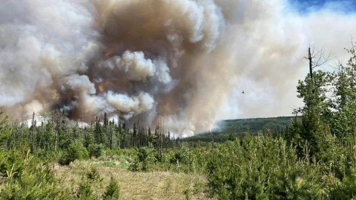 Facing unprecedented fire season, Canada confronts logistical challenge